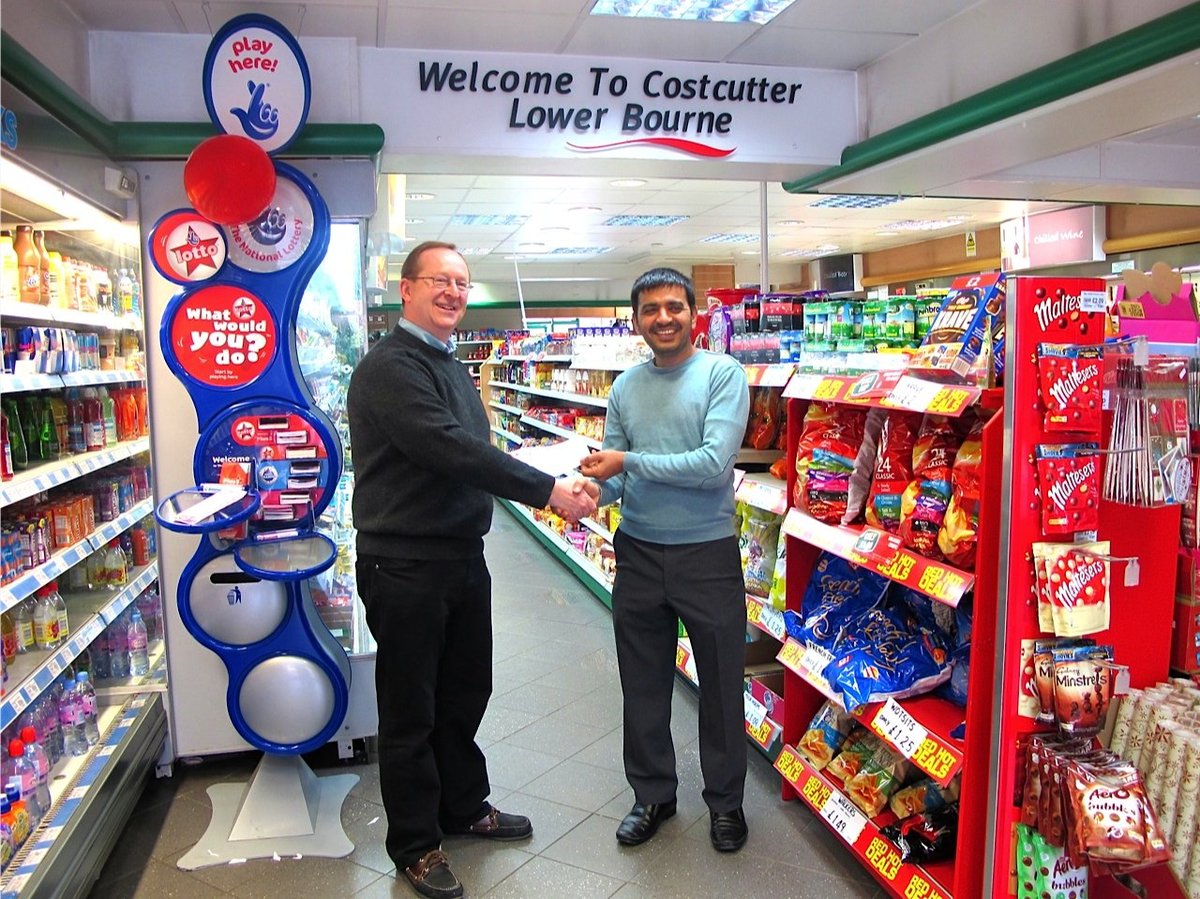 Minesh presenting cheque to treasurer Gordon Watson